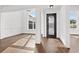 Elegant foyer with dark wood floors, decorative door, and detailed trim work at 163 Sago Palm Dr., Myrtle Beach, SC 29579