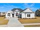Beautiful single-Gathering home boasts professionally landscaped front yard and neutral color palette at 163 Sago Palm Dr., Myrtle Beach, SC 29579
