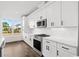 Bright kitchen features white cabinets, subway tile backsplash, stainless appliances, and hardwood floors at 163 Sago Palm Dr., Myrtle Beach, SC 29579