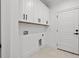 Functional laundry room with ample storage and white cabinetry at 163 Sago Palm Dr., Myrtle Beach, SC 29579
