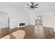 Spacious living room with a fireplace, wood floors, and plenty of natural light at 163 Sago Palm Dr., Myrtle Beach, SC 29579