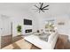 Bright living room with fireplace, white walls, and sliding glass doors at 163 Sago Palm Dr., Myrtle Beach, SC 29579