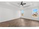 Spacious bedroom with a tray ceiling, hardwood floors, and lots of natural light at 163 Sago Palm Dr., Myrtle Beach, SC 29579