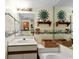 Well-lit bathroom with a vanity, sink, tub, and decorative sun accents at 1709 S Ocean Blvd. S # 205, North Myrtle Beach, SC 29582