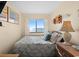Cozy bedroom with a large window showcasing an ocean view, creating a relaxing ambiance at 1709 S Ocean Blvd. S # 205, North Myrtle Beach, SC 29582