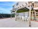 Outdoor seating area with tables and chairs, perfect for dining or relaxing outside at 1709 S Ocean Blvd. S # 205, North Myrtle Beach, SC 29582