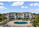 Aerial view of condominium complex with balconies overlooking the pool and sundeck at 1890 Colony Dr. # 17S, Myrtle Beach, SC 29575