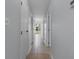 Clean, bright hallway with tile flooring leads to the front door and other rooms at 1890 Colony Dr. # 17S, Myrtle Beach, SC 29575