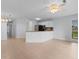 Bright kitchen and living area, featuring a breakfast bar, stainless steel appliances, and tile floors at 1890 Colony Dr. # 17S, Myrtle Beach, SC 29575