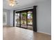 Living room with sliding glass doors that open onto a patio, providing natural light at 1890 Colony Dr. # 17S, Myrtle Beach, SC 29575