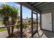 Inviting screened-in patio with views of the community pool and rose bushes at 1890 Colony Dr. # 17S, Myrtle Beach, SC 29575