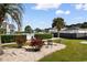 Well-maintained backyard with lush greenery, palm trees, and outdoor seating at 1890 Colony Dr. # 17S, Myrtle Beach, SC 29575