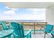 Relaxing balcony with seating overlooking the beach and ocean at 2001 S Ocean Blvd. # 210, Myrtle Beach, SC 29577