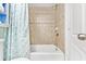Clean bathroom showcasing shower over tub, and tiled shower walls with fixtures at 2001 S Ocean Blvd. # 210, Myrtle Beach, SC 29577