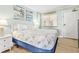 Bright bedroom offering ample natural light, comfy bed, and a view of the exit door at 2001 S Ocean Blvd. # 210, Myrtle Beach, SC 29577