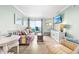 Bright living room with beach-themed decor, comfortable seating, and a view of the ocean at 2001 S Ocean Blvd. # 210, Myrtle Beach, SC 29577