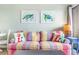 Comfortable living room featuring bright throw pillows and turtle art prints at 2001 S Ocean Blvd. # 210, Myrtle Beach, SC 29577
