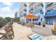 Outdoor patio and bar area with seating, tables, and umbrellas for a relaxing experience at 2001 S Ocean Blvd. # 210, Myrtle Beach, SC 29577