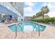 Inviting outdoor pool with stainless steel handrails surrounded by brick pavers near restaurant at 2001 S Ocean Blvd. # 210, Myrtle Beach, SC 29577