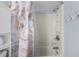 Bathroom features a shower and tub with a marble-patterned shower curtain and towel hooks on the wall at 208 74Th Ave. N # 2517, Myrtle Beach, SC 29572