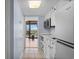 A well-equipped kitchen space leads to a cozy balcony, perfect for enjoying meals with a scenic view at 208 74Th Ave. N # 2517, Myrtle Beach, SC 29572