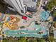 Aerial view of a waterpark with pools, slides, and lazy river, offering fun for all ages at 208 74Th Ave. N # 2517, Myrtle Beach, SC 29572