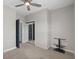 Empty bedroom with mirrored closet doors and wall-mounted TV stand at 224 Castle Dr. # 1404, Myrtle Beach, SC 29579