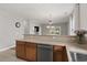 Open kitchen view that includes an island and stainless dishwasher at 224 Castle Dr. # 1404, Myrtle Beach, SC 29579
