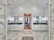 Elegant Primary bathroom with double vanities, marble floors, and large glass enclosed shower at 2300 Tansy Rd., Loris, SC 29569