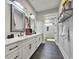 Modern bathroom with double vanity, quartz countertop, black hardware, and tile floors at 2300 Tansy Rd., Loris, SC 29569