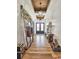 Inviting entryway with wood floors, shiplap walls, and stylish light fixtures at 2300 Tansy Rd., Loris, SC 29569