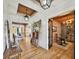 Charming entryway showcases wood floors leading to the kitchen and cozy study area at 2300 Tansy Rd., Loris, SC 29569