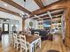 Open-concept living room with wood beams, fireplace, built-in shelves, and comfortable seating at 2300 Tansy Rd., Loris, SC 29569