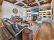 Cozy living room featuring coffered ceilings, a brick fireplace, and comfortable seating at 2300 Tansy Rd., Loris, SC 29569