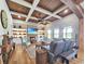 Open-concept living room with coffered ceilings and a brick fireplace at 2300 Tansy Rd., Loris, SC 29569