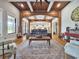 Spacious living room with wood beam archway, large windows, and a comfortable sofa at 2300 Tansy Rd., Loris, SC 29569