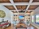 Cozy living room featuring coffered ceilings, a brick fireplace, and comfortable seating at 2300 Tansy Rd., Loris, SC 29569