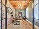 Cozy study featuring brick accent wall, wood ceiling, and quaint decor at 2300 Tansy Rd., Loris, SC 29569