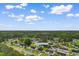 Aerial view showing the home's location within a suburban neighborhood surrounded by lush greenery at 2446 Farmwood Circle, Conway, SC 29527