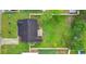 An overhead aerial view shows a well-maintained house and a spacious, green backyard at 2446 Farmwood Circle, Conway, SC 29527