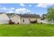 Back of house with well-maintained backyard, patio, and garden at 2446 Farmwood Circle, Conway, SC 29527