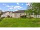 View of backyard featuring lush green grass, patio area, and a partial fence at 2446 Farmwood Circle, Conway, SC 29527
