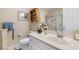 Bright bathroom featuring a single sink vanity, floral shower curtain, and decorative accents at 2446 Farmwood Circle, Conway, SC 29527