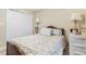 Cozy bedroom featuring a wooden bed frame, floral bedding, and bright lighting from two bedside lamps at 2446 Farmwood Circle, Conway, SC 29527