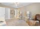 Bright bedroom with neutral walls, ceiling fan, and comfortable seating at 2446 Farmwood Circle, Conway, SC 29527