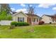 Lovely home with a neat lawn and decorative bushes in the front yard at 2446 Farmwood Circle, Conway, SC 29527