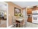 Inviting kitchen/dining area with decorative artwork and access to living space at 2446 Farmwood Circle, Conway, SC 29527