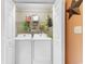 Convenient laundry closet with a washer and dryer, plus shelving for supplies at 2446 Farmwood Circle, Conway, SC 29527