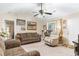 Comfortable living room featuring a ceiling fan, a window with natural light, and a plush recliner at 2446 Farmwood Circle, Conway, SC 29527
