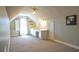 Bright attic space with a vaulted ceiling, dormer window, built-in desk area and neutral decor at 2703 Canvasback Trail, Myrtle Beach, SC 29588